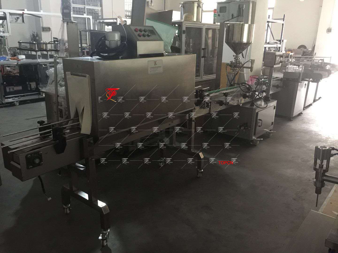 Canada customer purchased Automatic cosmetic cream hot wax grease filling machine with mixing