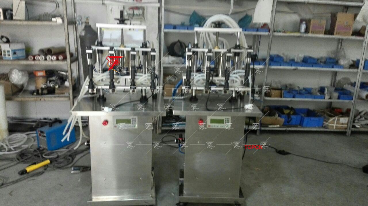 Poland Customer ordered Semi automatic four head price perfume vacuum bottle filling machine